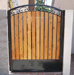 Wrought iron small yard gate with wooden backing